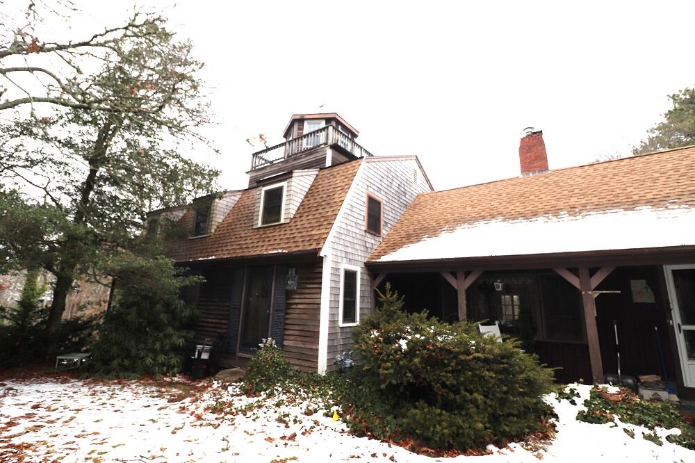 930 Old Bass River Road Dennis, MA 02638 - Photo 2 of 34 a front view of a house