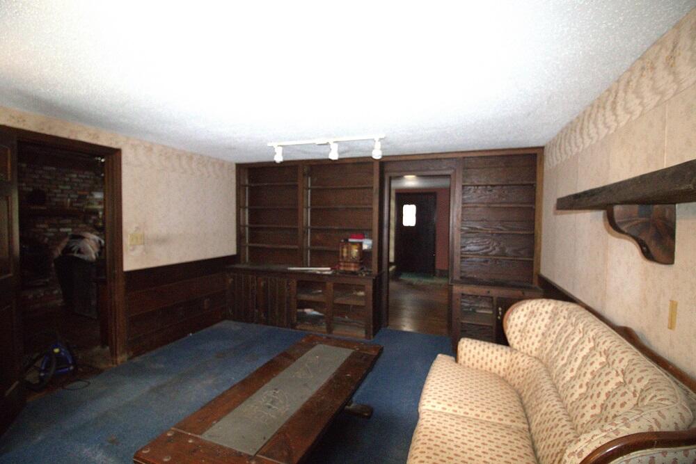 930 Old Bass River Road Dennis, MA 02638 - Photo 7 of 34 a living room with furniture a air conditioner vent and a window