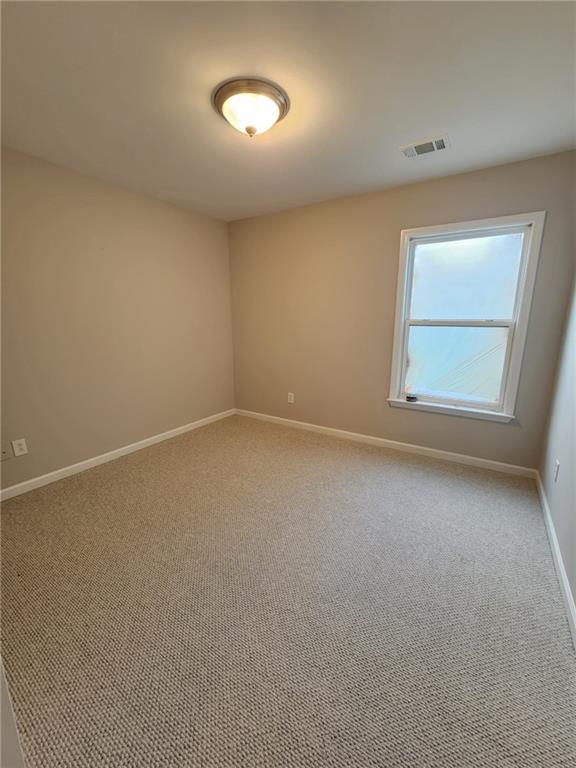 5520 Casey Valley Way Cumming, GA 30040 - Photo 13 of 25 an empty room with a window