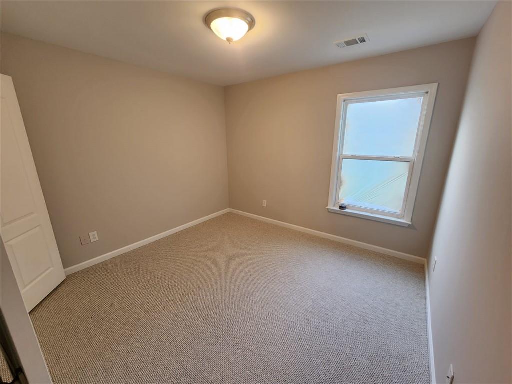 5520 Casey Valley Way Cumming, GA 30040 - Photo 17 of 25 an empty room with a window