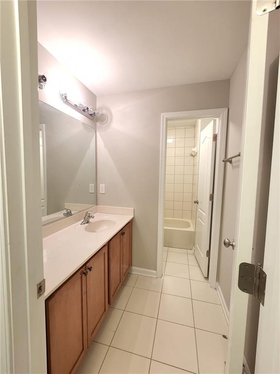 5520 Casey Valley Way Cumming, GA 30040 - Photo 19 of 25 a bathroom with a double vanity sink and mirror