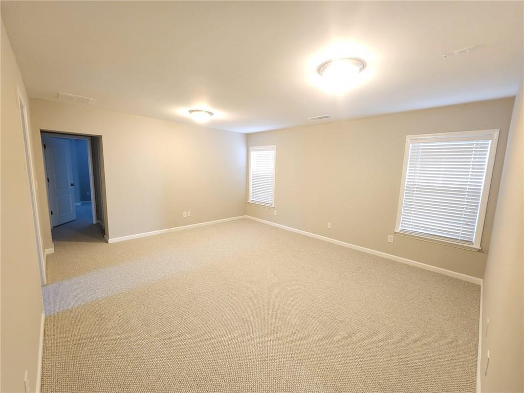 5520 Casey Valley Way Cumming, GA 30040 - Photo 21 of 25 a view of an empty room with a window