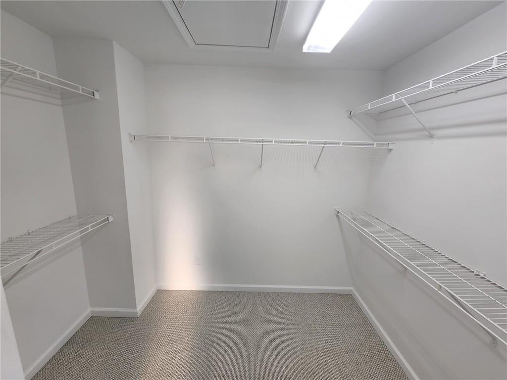 5520 Casey Valley Way Cumming, GA 30040 - Photo 25 of 25 a view of a room with racks on the wall