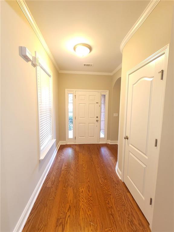 5520 Casey Valley Way Cumming, GA 30040 - Photo 3 of 25 a view of an empty room with wooden floor and a window