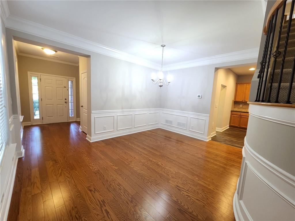5520 Casey Valley Way Cumming, GA 30040 - Photo 5 of 25 wooden floor in an empty room with a window