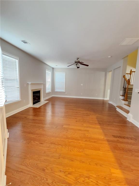 5520 Casey Valley Way Cumming, GA 30040 - Photo 6 of 25 wooden floor in an empty room with a fireplace