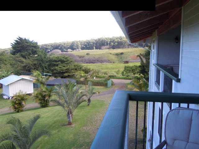 646 Awalau Road Haiku, HI 96708 - Photo 15 of 28 a balcony with wooden floor and lake view