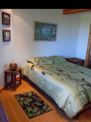 646 Awalau Road Haiku, HI 96708 - Photo 17 of 28 a bed sitting in a bedroom next to a window