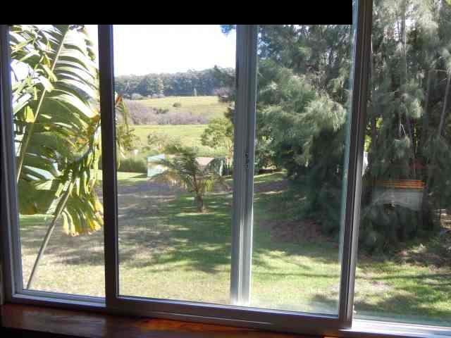 646 Awalau Road Haiku, HI 96708 - Photo 21 of 28 a view of a glass door and a yard