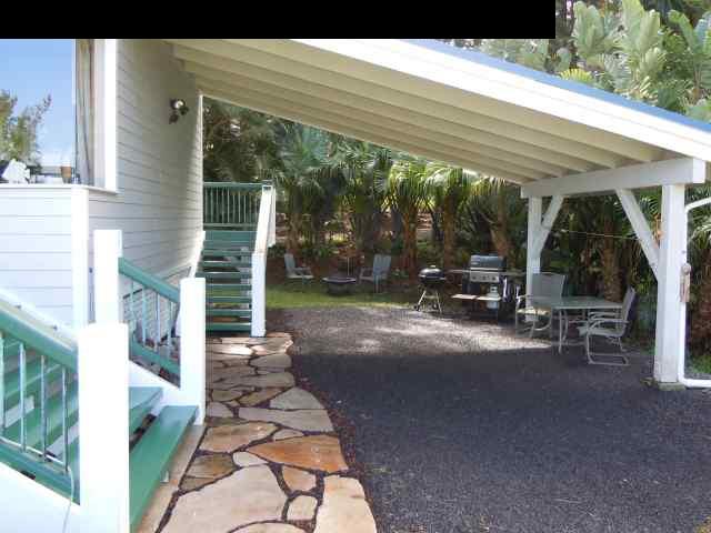 646 Awalau Road Haiku, HI 96708 - Photo 25 of 28 a view of a patio with table and chairs under an umbrella