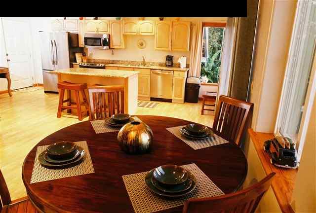 646 Awalau Road Haiku, HI 96708 - Photo 4 of 28 a room with furniture and a wooden floor