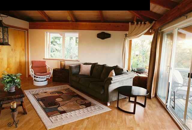 646 Awalau Road Haiku, HI 96708 - Photo 7 of 28 a living room with furniture and a window