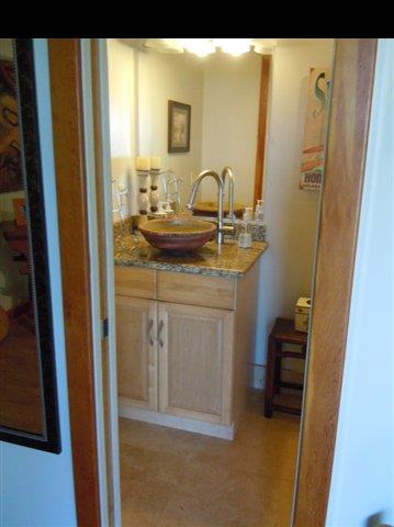 646 Awalau Road Haiku, HI 96708 - Photo 8 of 28 a en suite bathroom with a granite countertop sink and a mirror