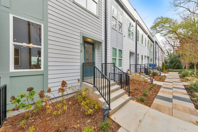 a view of a patio with couches and potted plants