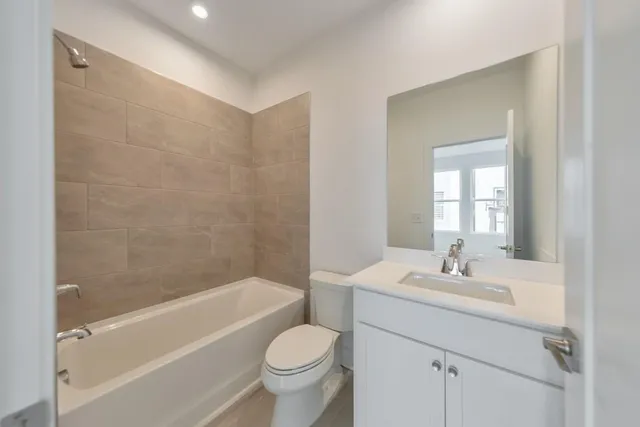 a bathroom with a sink toilet and bathtub