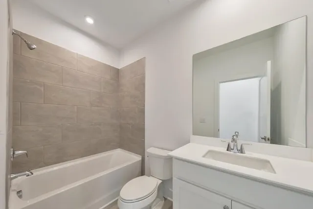 a bathroom with a sink a toilet and a bathtub