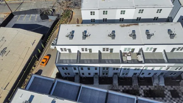 a picture of a bench in front of a wall