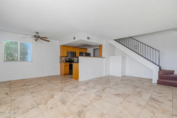 a view of a room with a kitchen