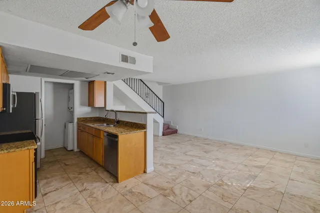 a kitchen with kitchen island cabinets and oven