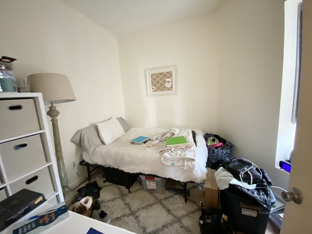 96 Hammond Street, Unit 3 Boston, MA 02120 - Photo 6 of 8 a view of a workspace with furniture and a window