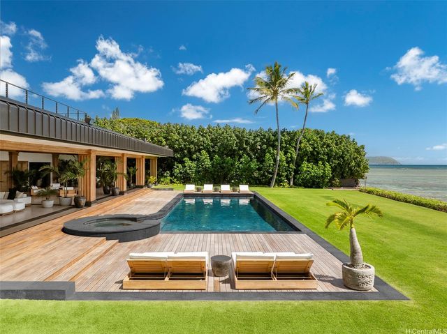 a view of swimming pool with seating space