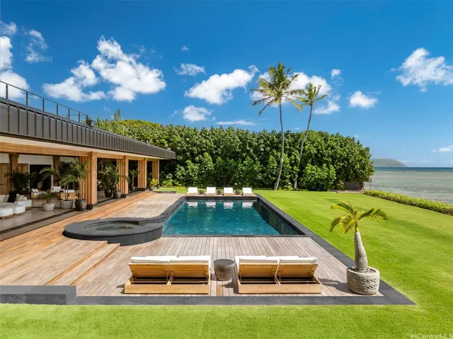 a view of swimming pool with seating space