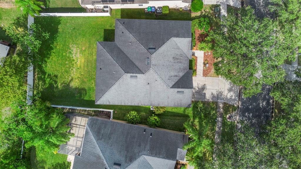 2414 Ridgemoor Drive Orlando, FL 32828 - Photo 11 of 45 an aerial view of a house with a garden