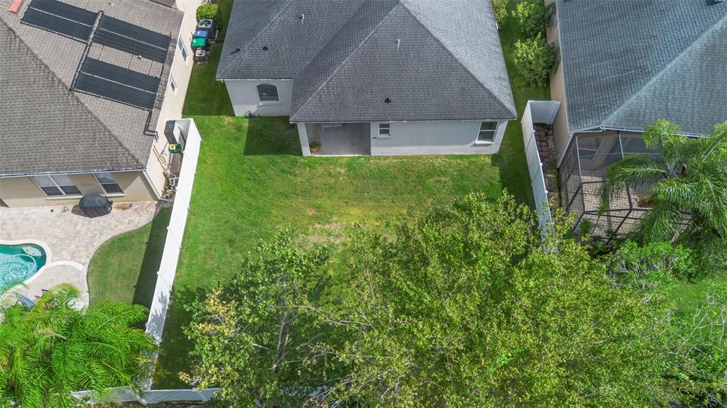 2414 Ridgemoor Drive Orlando, FL 32828 - Photo 12 of 45 a view of a house with a backyard