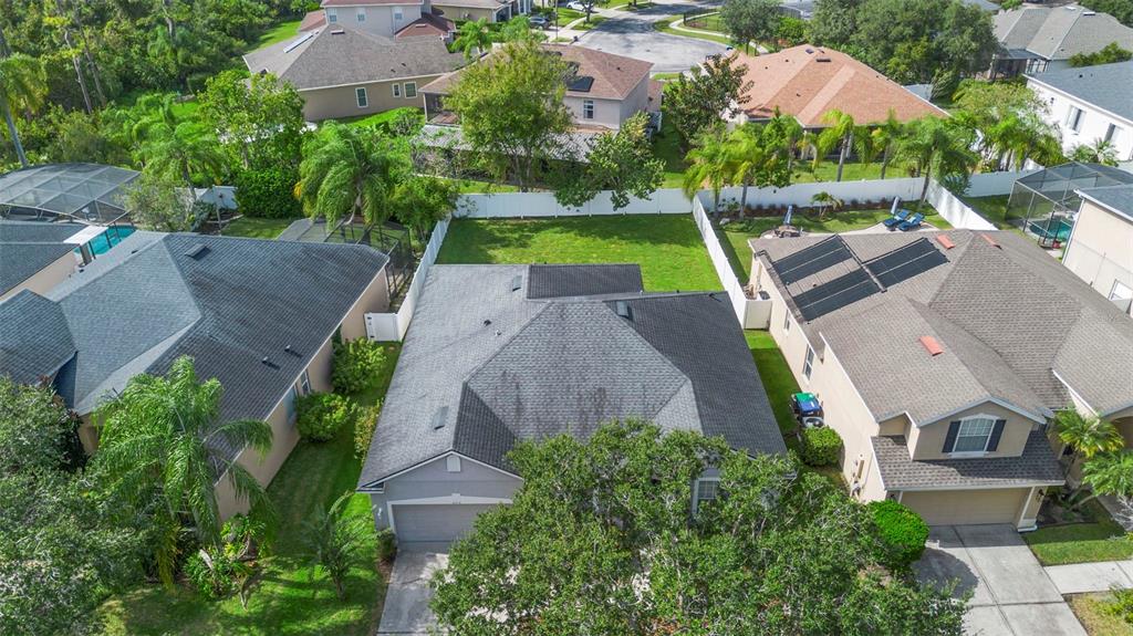 2414 Ridgemoor Drive Orlando, FL 32828 - Photo 13 of 45 an aerial view of multiple houses with yard
