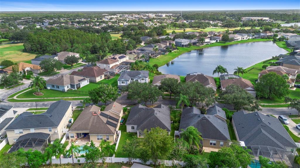 2414 Ridgemoor Drive Orlando, FL 32828 - Photo 15 of 45 an aerial view of city lake and residential houses with outdoor space