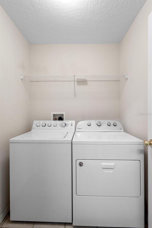 2414 Ridgemoor Drive Orlando, FL 32828 - Photo 21 of 45 a utility room with dryer and washer