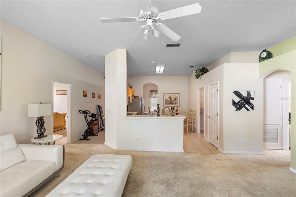 2414 Ridgemoor Drive Orlando, FL 32828 - Photo 28 of 45 a living room with furniture and kitchen view