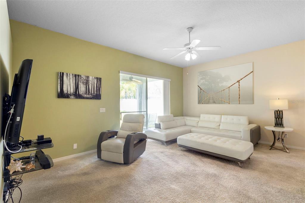 2414 Ridgemoor Drive Orlando, FL 32828 - Photo 29 of 45 a living room with furniture a air conditioner vent and a window