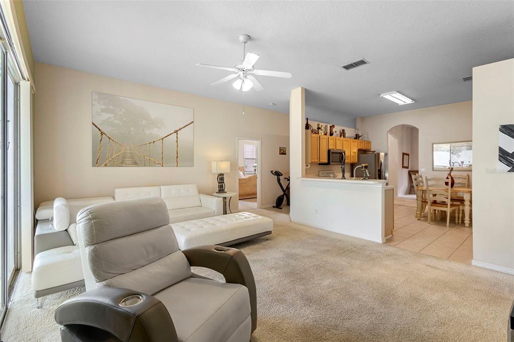 2414 Ridgemoor Drive Orlando, FL 32828 - Photo 31 of 45 a living room with furniture and kitchen view