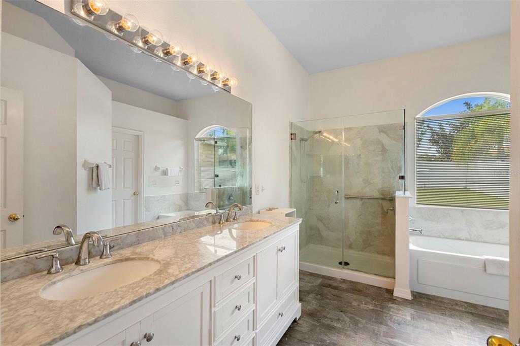 2414 Ridgemoor Drive Orlando, FL 32828 - Photo 34 of 45 a bathroom with a granite countertop double vanity sink mirror double and shower