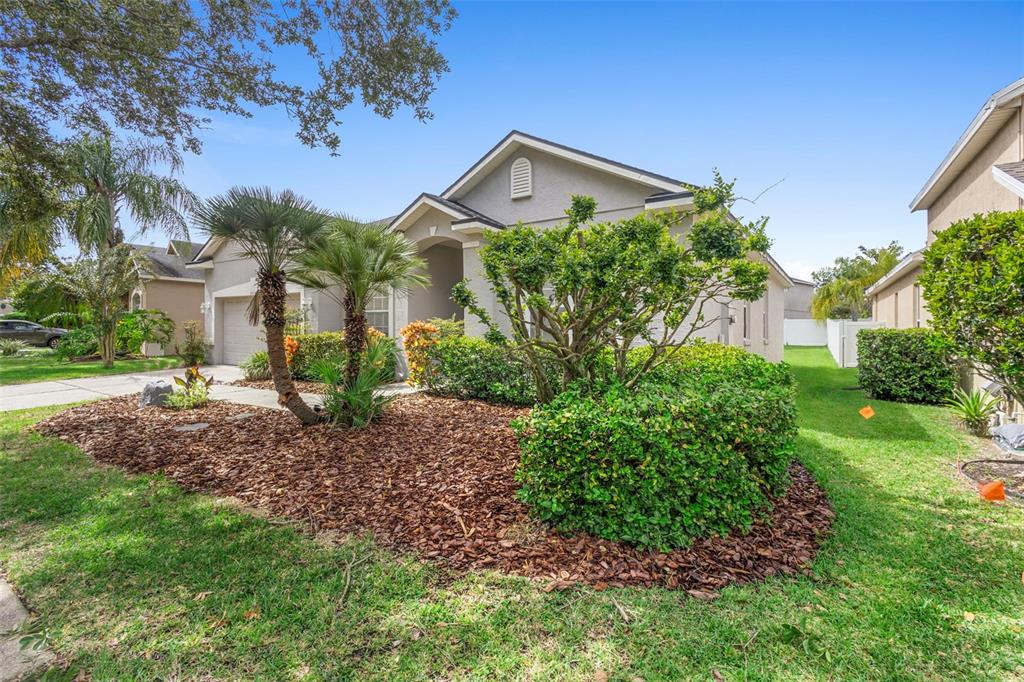 2414 Ridgemoor Drive Orlando, FL 32828 - Photo 4 of 45 a front view of a house with garden