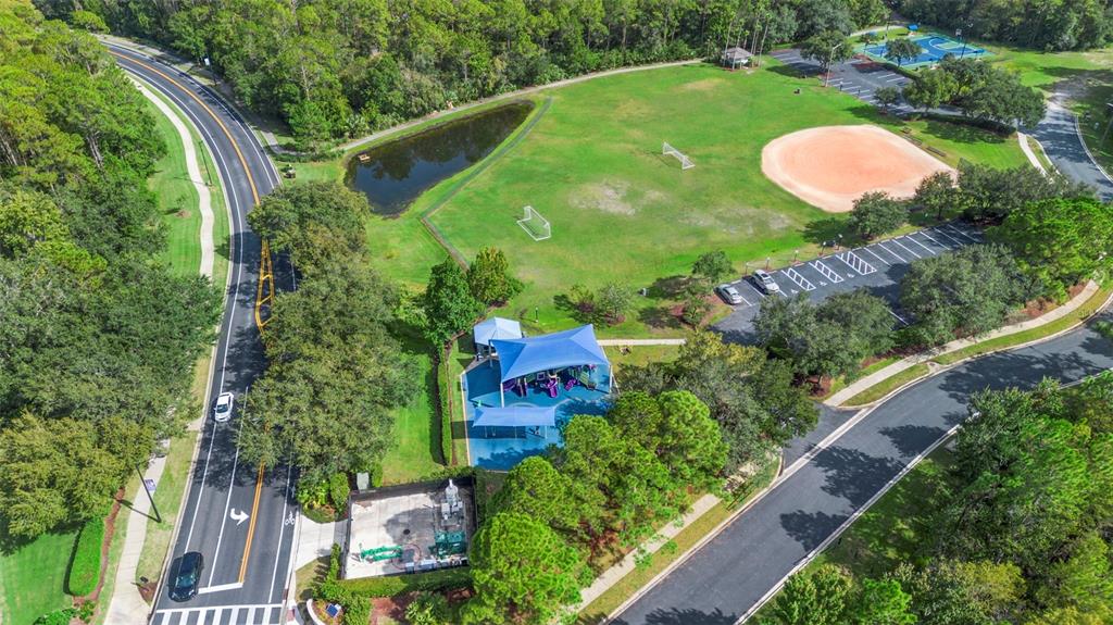 2414 Ridgemoor Drive Orlando, FL 32828 - Photo 42 of 45 an aerial view of a house with a yard and outdoor seating