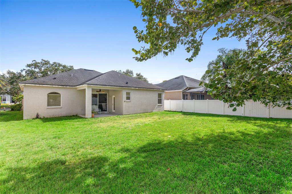 2414 Ridgemoor Drive Orlando, FL 32828 - Photo 9 of 45 a view of a yard in front of a house