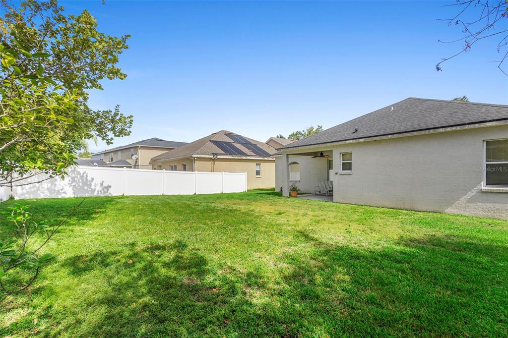 2414 Ridgemoor Drive Orlando, FL 32828 - Photo 10 of 45 a view of a house with a yard