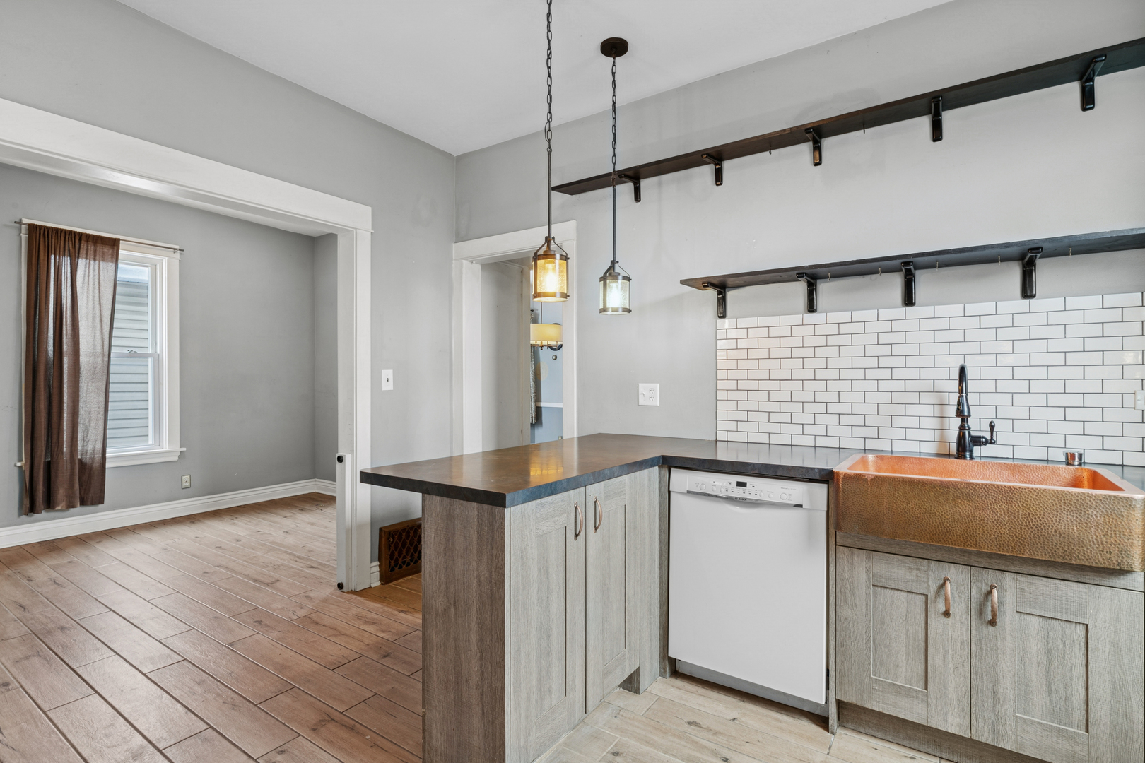 5218 West Patterson Avenue Chicago, IL 60641 - Photo 12 of 29 a kitchen with granite countertop a sink and cabinets