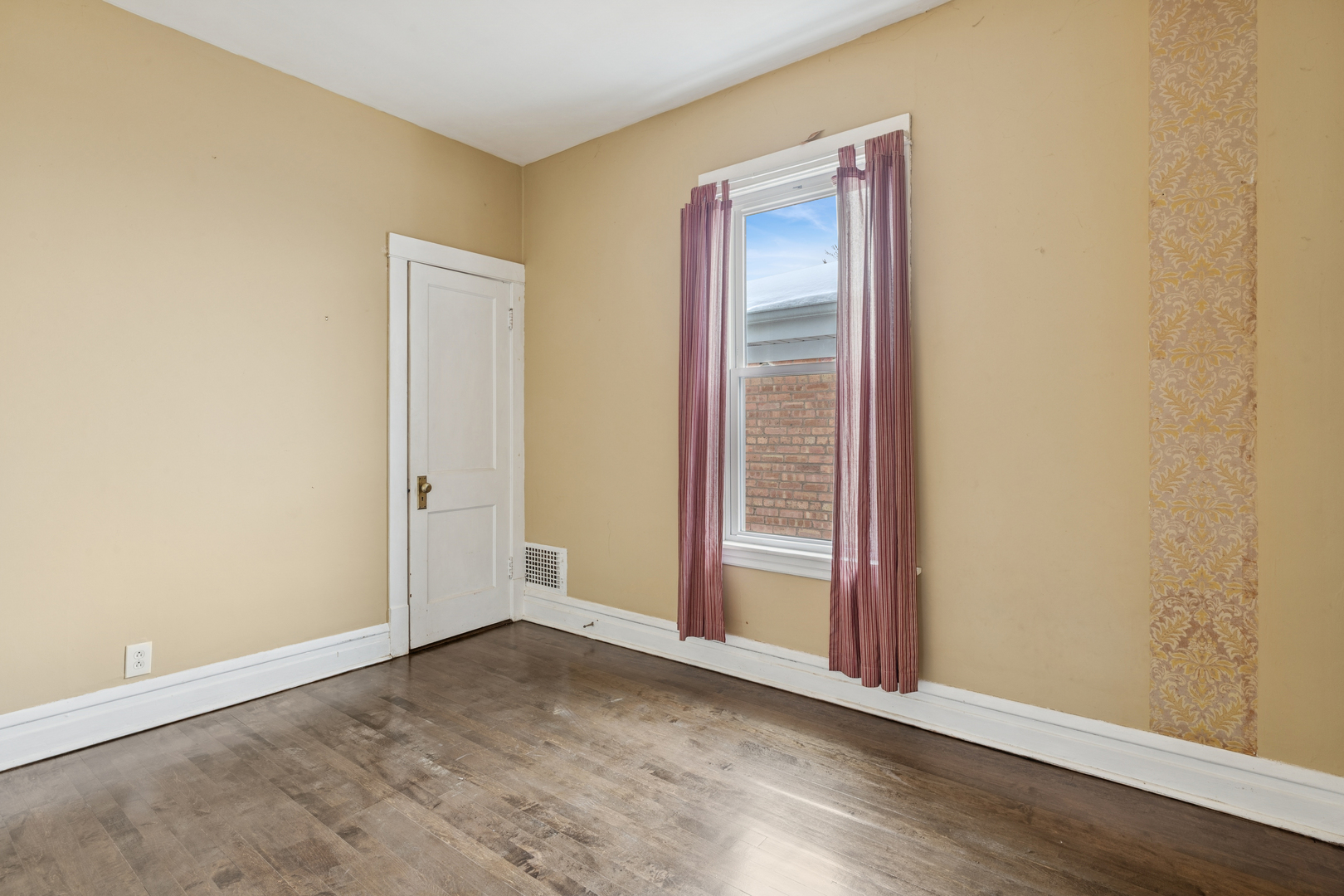 5218 West Patterson Avenue Chicago, IL 60641 - Photo 13 of 29 an empty room with wooden floor and windows