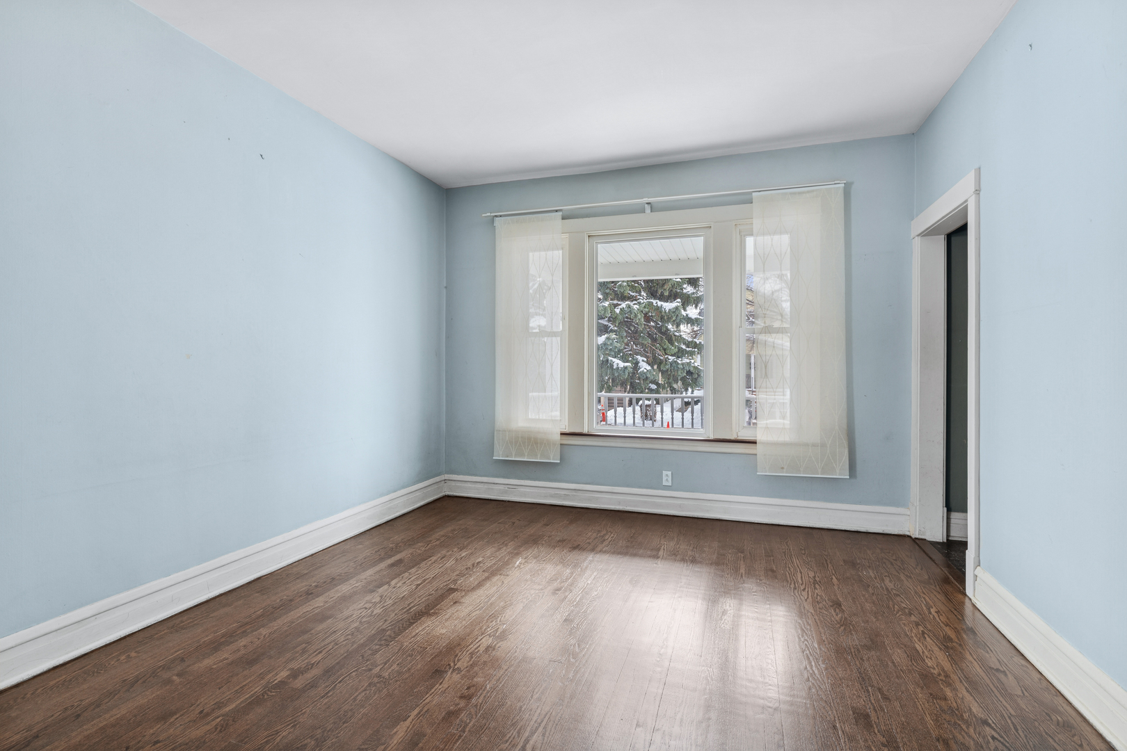 5218 West Patterson Avenue Chicago, IL 60641 - Photo 2 of 29 an empty room with wooden floor and windows