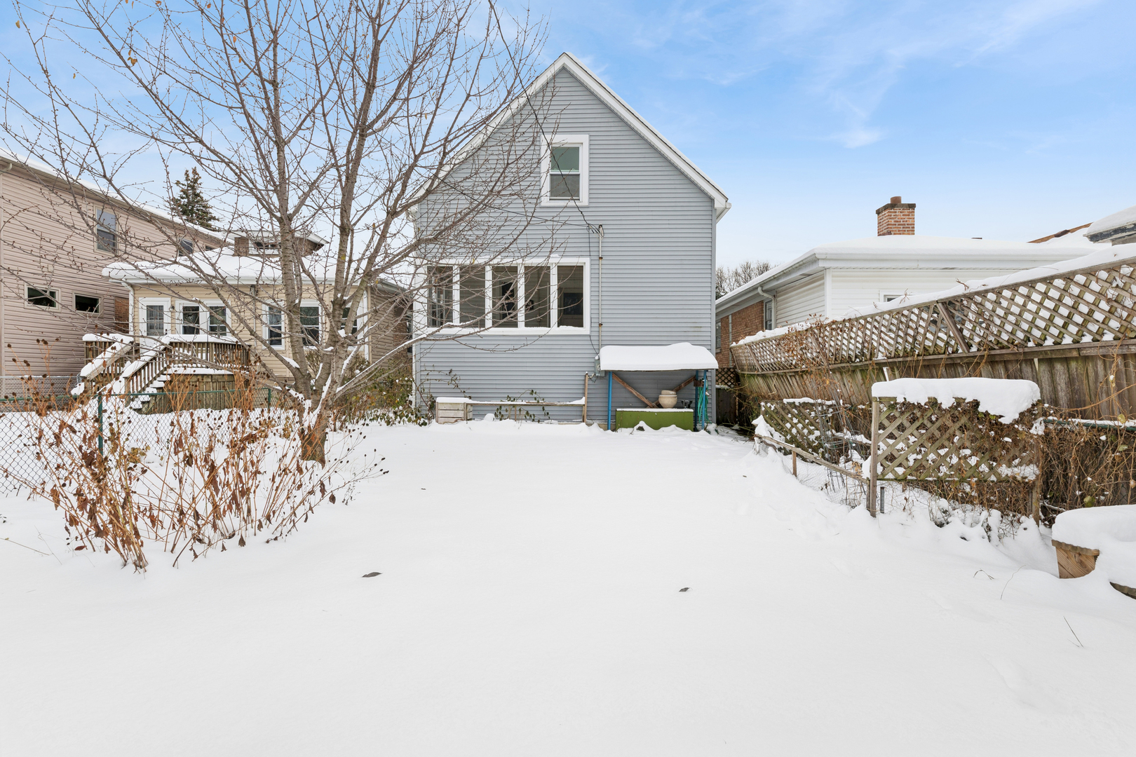 5218 West Patterson Avenue Chicago, IL 60641 - Photo 25 of 29 a view of a house with snow on the road