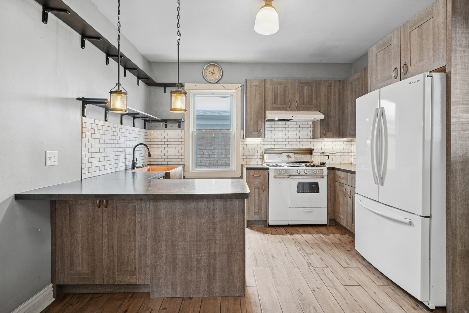 5218 West Patterson Avenue Chicago, IL 60641 - Photo 10 of 29 a kitchen with stainless steel appliances a refrigerator and a stove