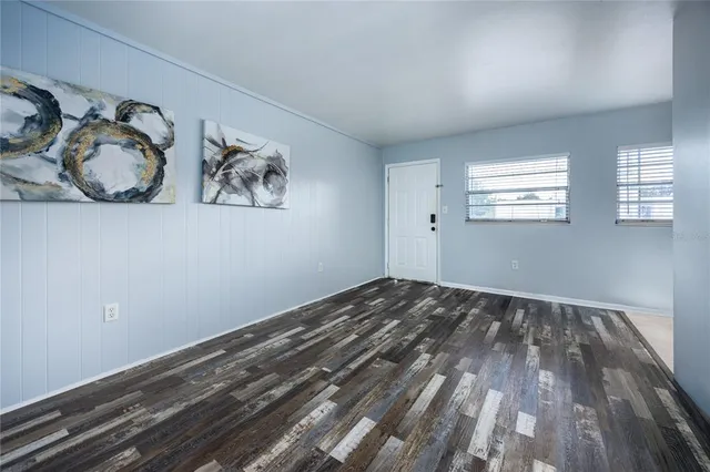 a view of room with window and hardwood floor