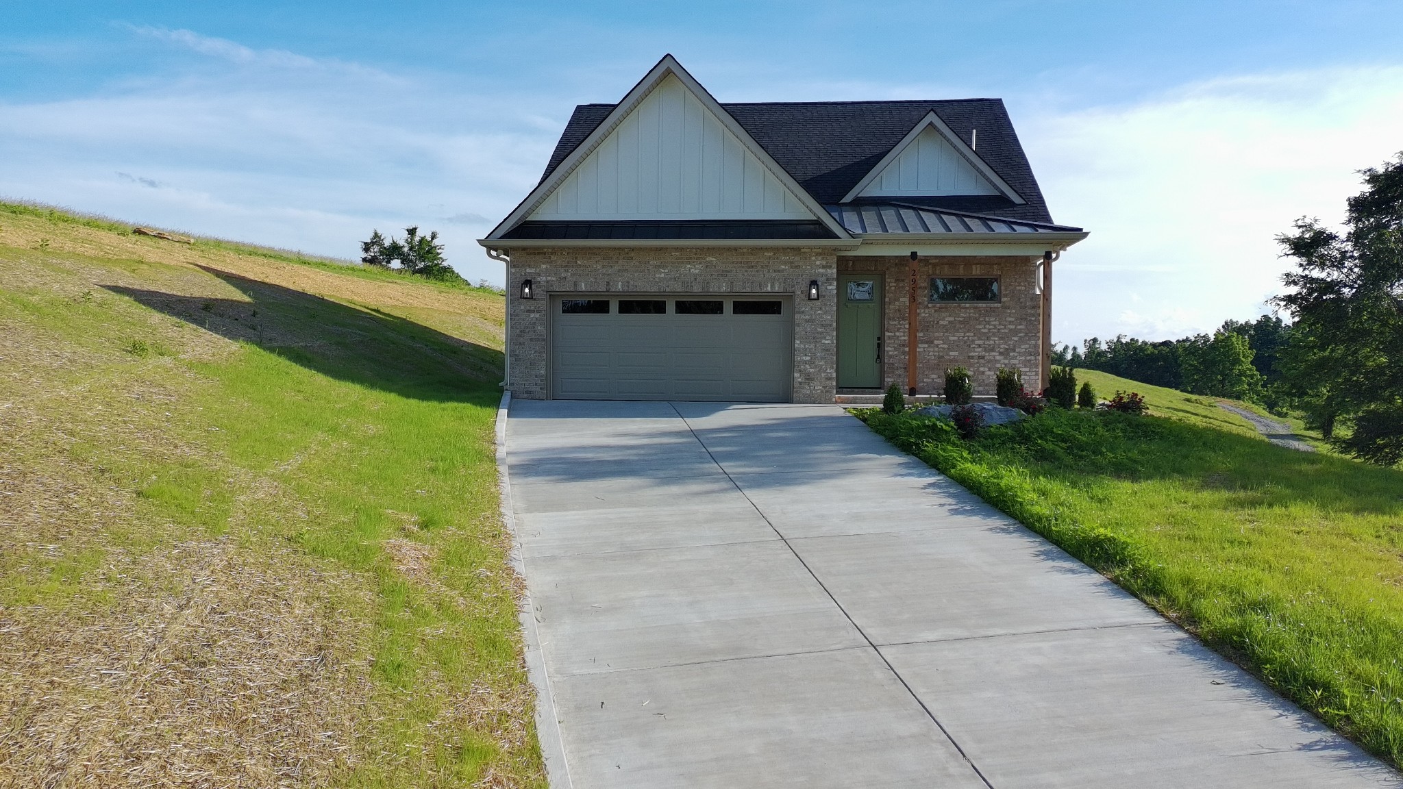 2953 Wixtown Road Westmoreland, TN 37186 - Photo 1 of 35 a front view of a house with yard