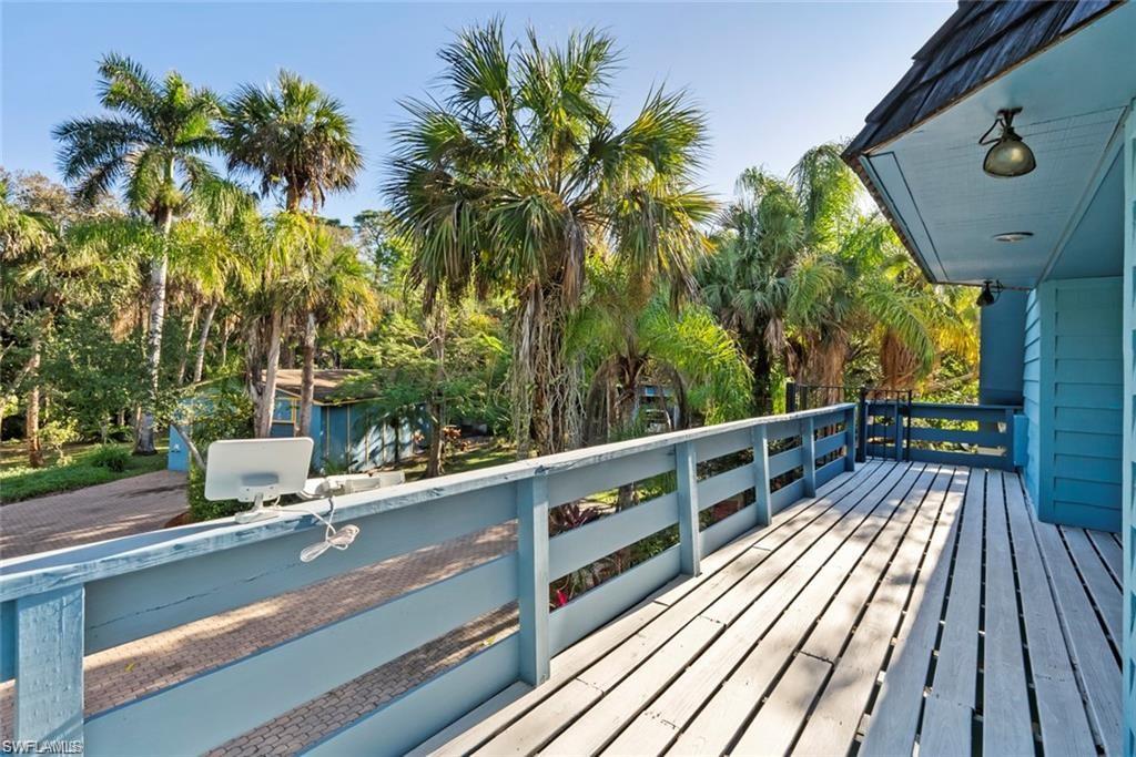 3550 Hazel Road Naples, FL 34104 - Photo 20 of 43 a view of balcony with wooden floor and outdoor space