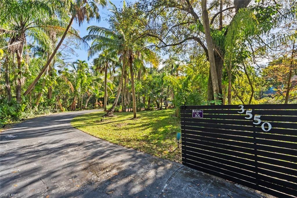 3550 Hazel Road Naples, FL 34104 - Photo 3 of 43 a view of a yard with large trees