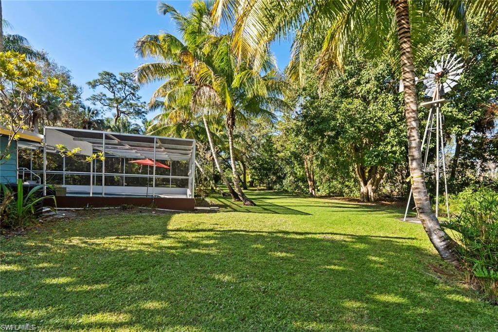 3550 Hazel Road Naples, FL 34104 - Photo 32 of 43 a view of a house with a big yard