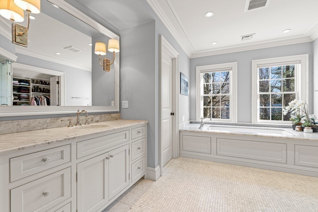 15 Valley Road Wellesley, MA 02481 - Photo 23 of 42 a bathroom with a granite countertop sink mirror and next to a window